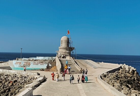 Aerial view of Dwarka city, showcasing temples, ghats, and the Arabian Sea coastline.