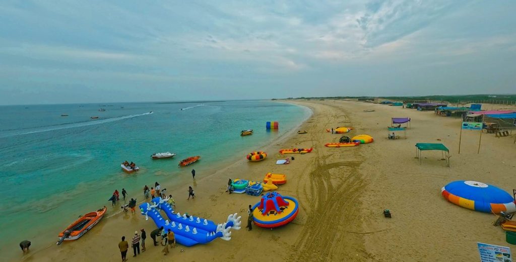 Aerial view of Dwarka city, showcasing temples, ghats, and the Arabian Sea coastline.