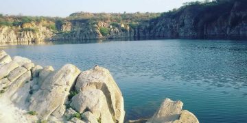 A scenic view of Faridabad showcasing its industrial skyline, cultural landmarks, and bustling street markets.