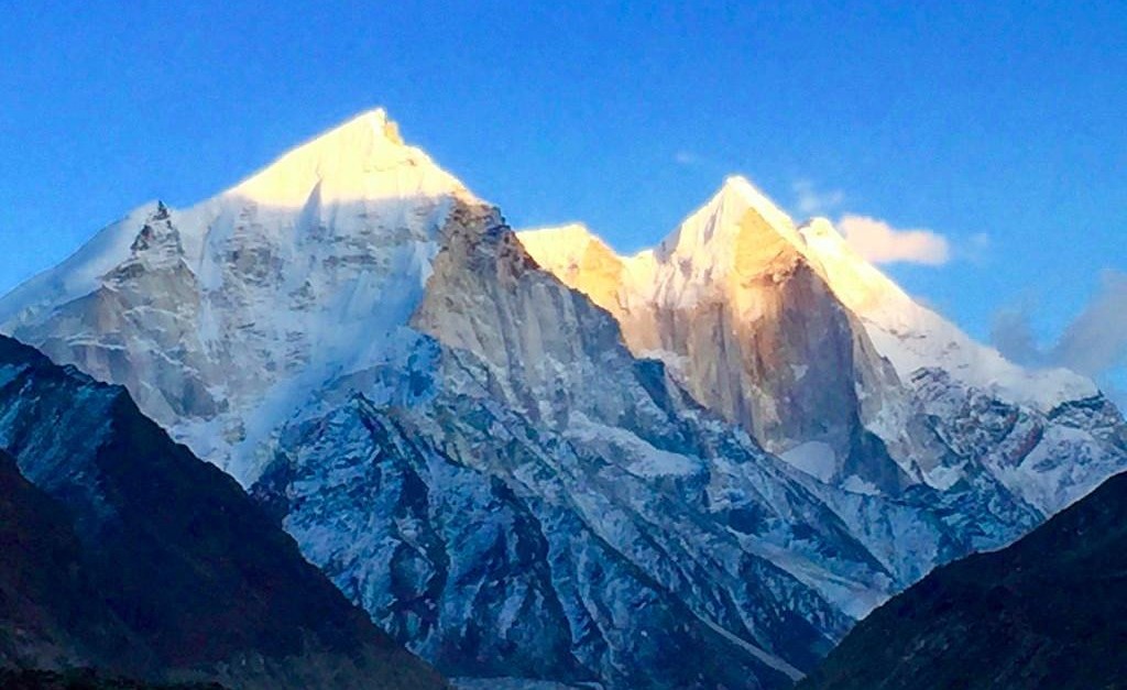 "A breathtaking view of Uttarkashi with the Bhagirathi River flowing through the Himalayas."

