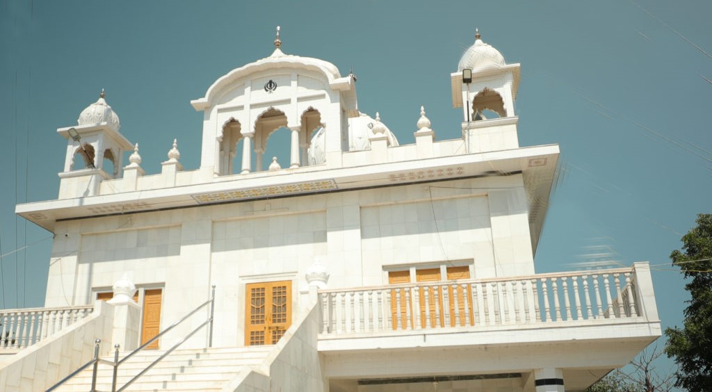 Aerial view of Dwarka city, showcasing temples, ghats, and the Arabian Sea coastline.