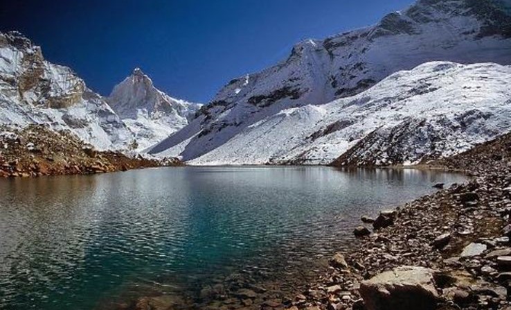 "A breathtaking view of Uttarkashi with the Bhagirathi River flowing through the Himalayas."

