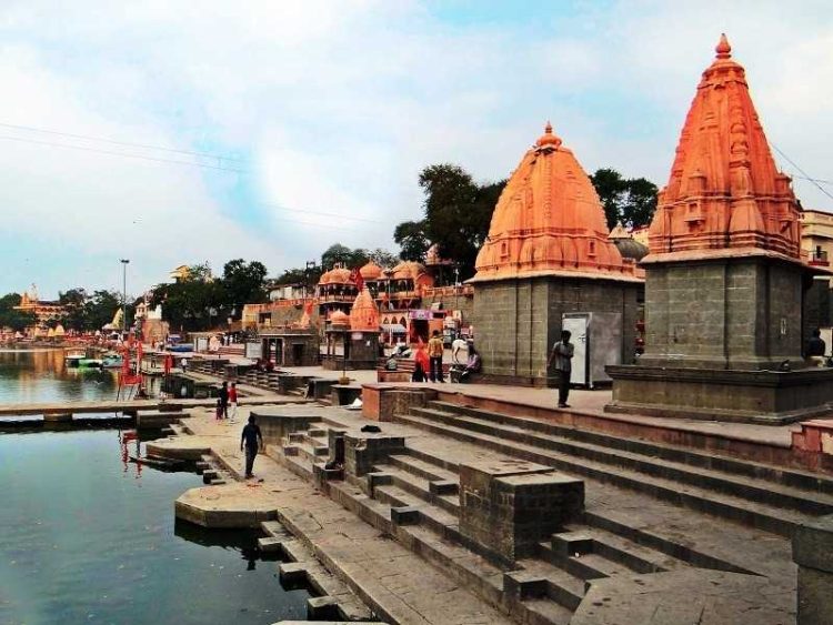 Ujjain: The Spiritual Heart of Madhya Pradesh, showcasing the iconic Mahakaleshwar Temple and serene Shipra River ghats.
