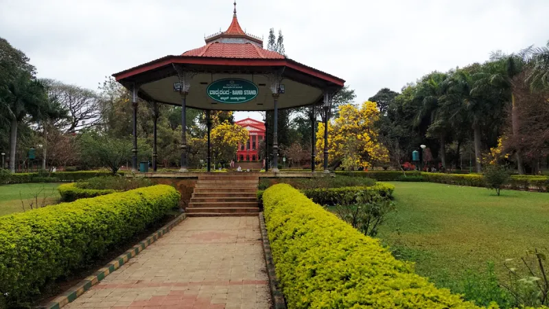 Exploring the Garden City: Visitors walking through the lush greenery of Cubbon Park in Bengaluru